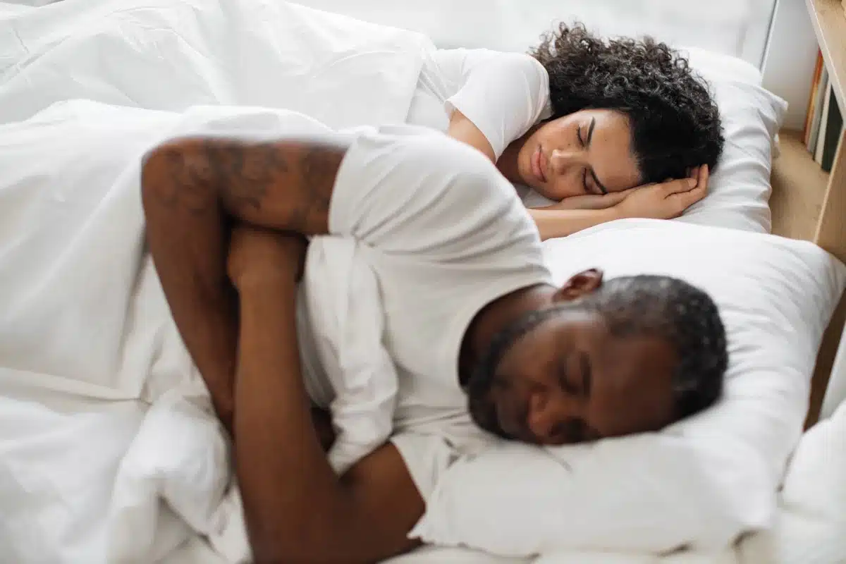 multicultural family sleeping sweet together bed